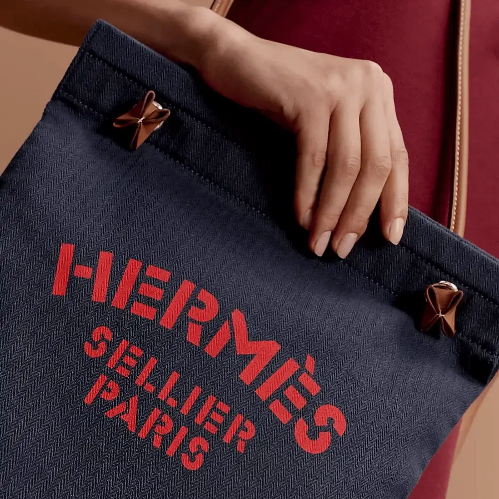 Hermes Aline grooming Bag in Swift calfskin bleu indigo gold Model shots 3