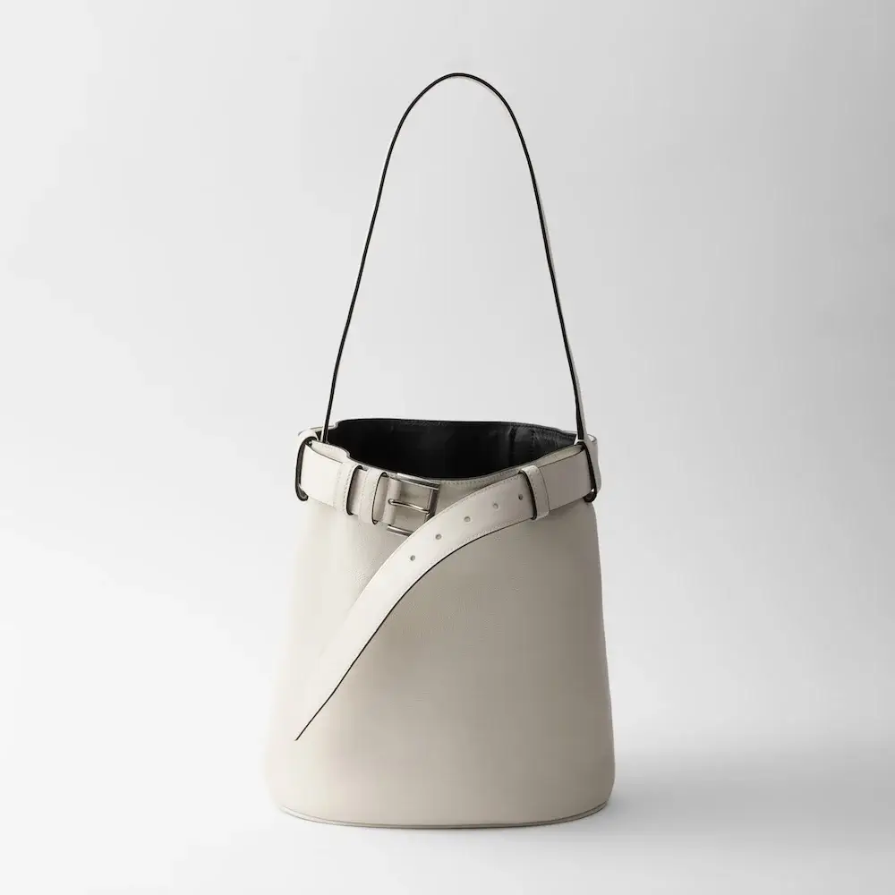 Prada Buckle leather bucket bag with belt black white