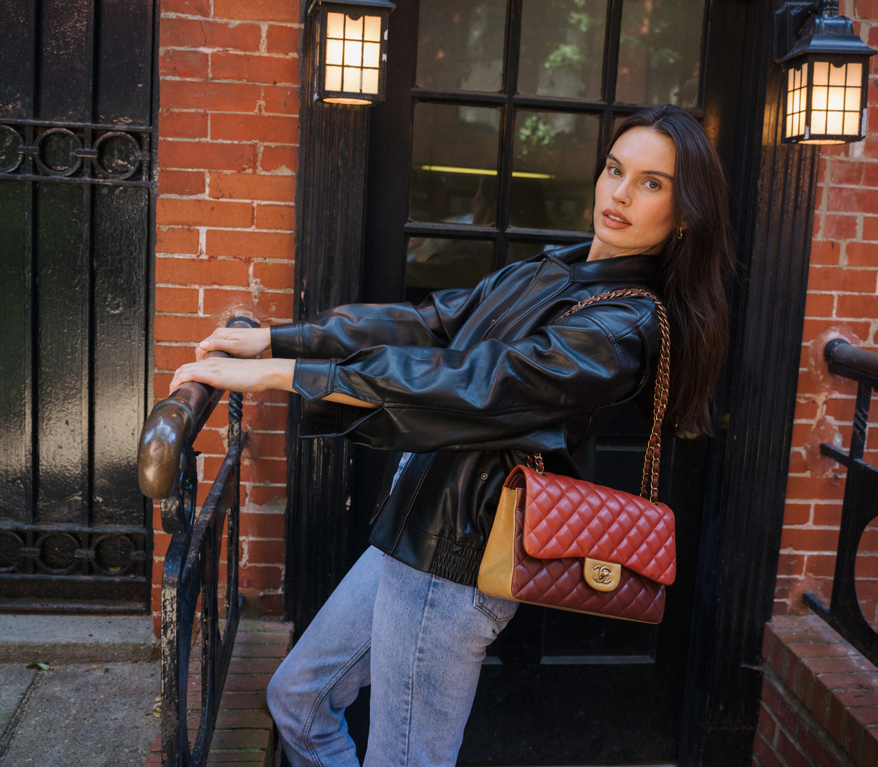 woman wearing red and brown Chanel bag